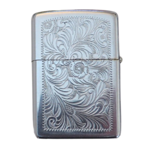 A silver zippo lighter with a floral design.