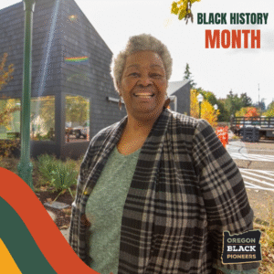An older Black woman stands outside smiling, with modern buildings in the background. Text reads "Black History Month" and "Oregon Black Pioneers.