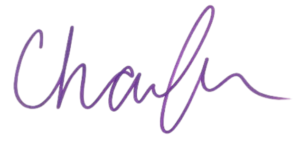 The image shows the word "Charlotte" written in purple cursive handwriting on a white background. 